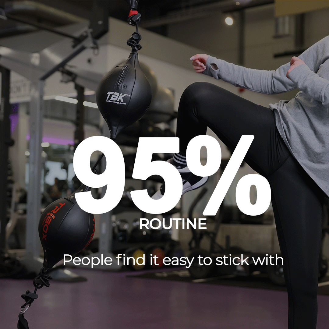 Lady kicking the Triboxking in a gym 95% keep up the routine