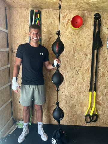 Man next to Triboxking smiling